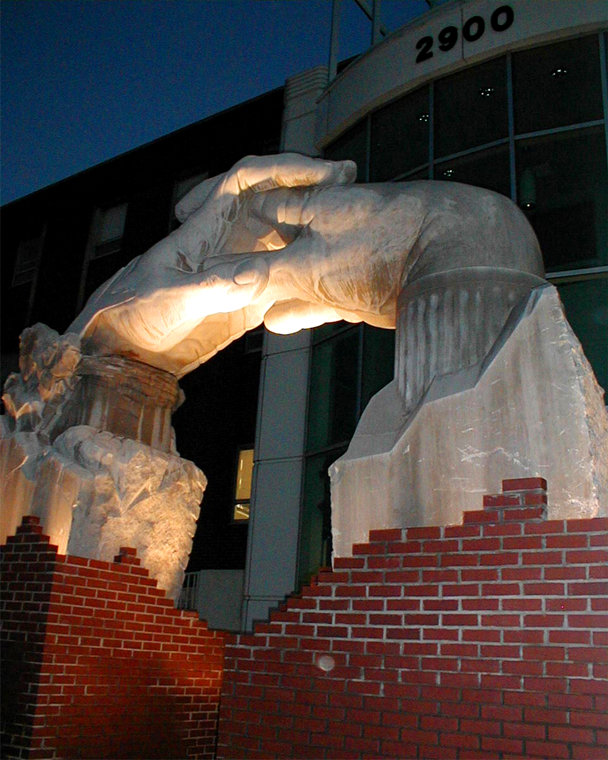 Opportunity Portal Sculpture in Indiana Limestone, nightime view.